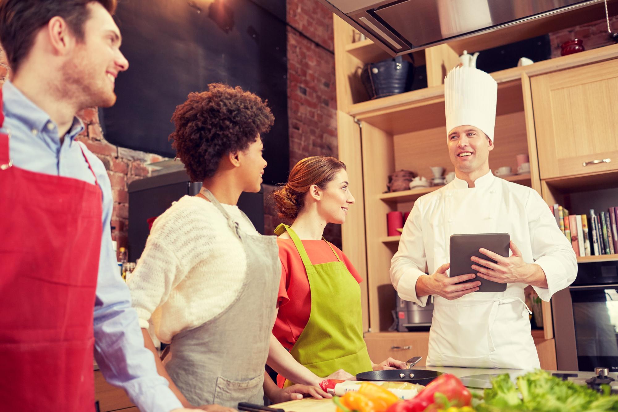 Small group receiving feedback from chef